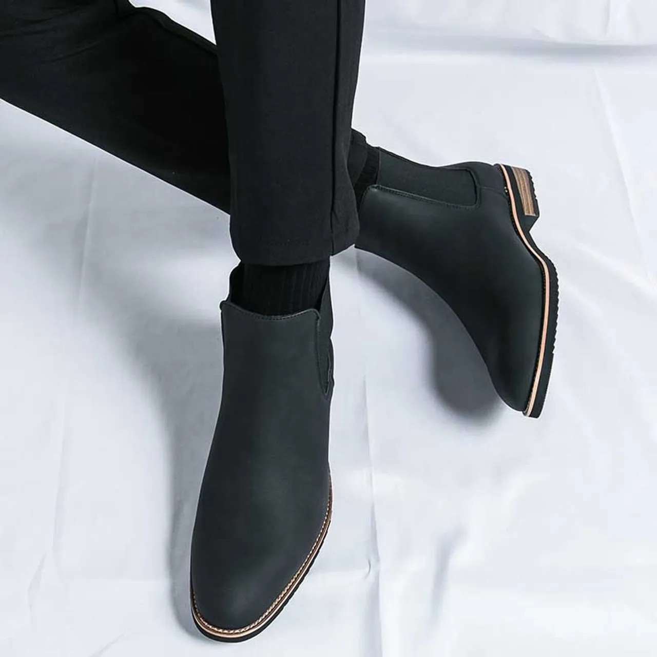 Black plain sewn accents slip on shoe boot