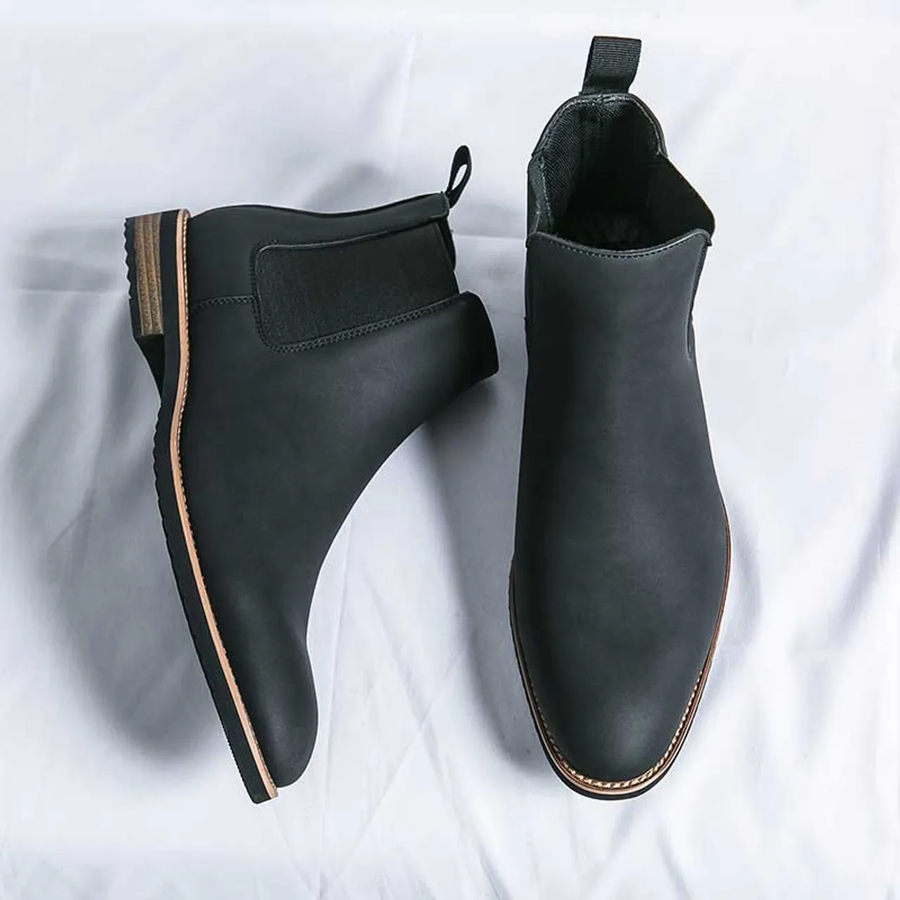 Black plain sewn accents slip on shoe boot