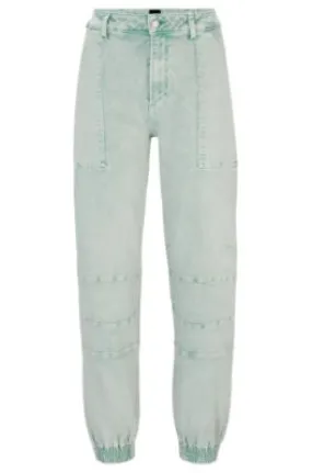 Cuffed relaxed-fit cargo jeans in rigid denim